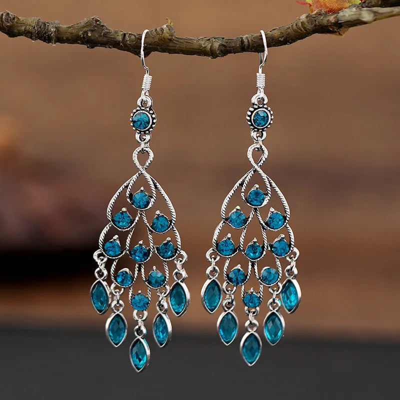 Purple long fringe drop earrings with crystals on a retro ethnic style alloy setting.