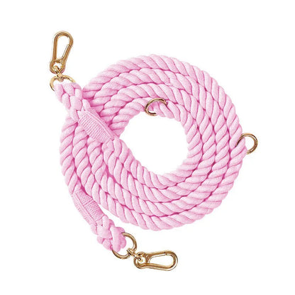 Woven rainbow pattern dog leash with double grip handles and a metal clasp.