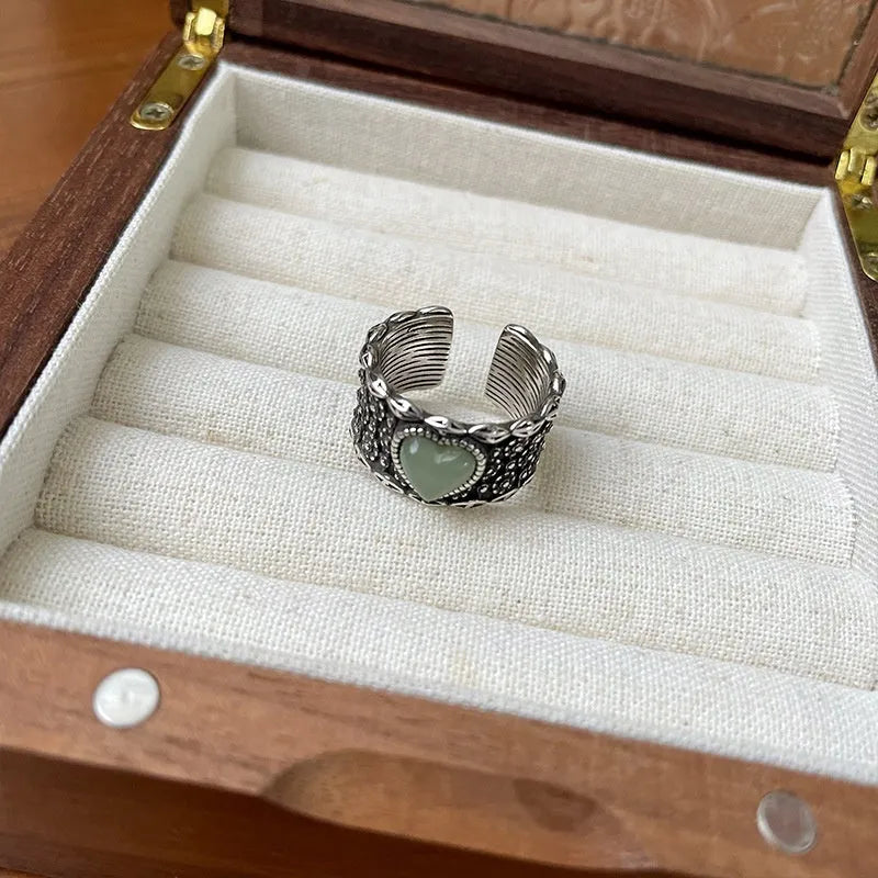 Retro wide-faced heart-shaped silver ring with adjustable opening in white or green colour