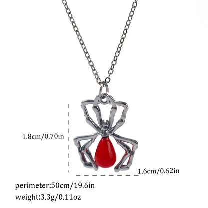 Gothic style zinc alloy necklace with bat pendant on a silver chain against dark background.