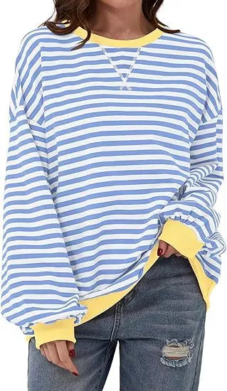 Striped sweatshirt in navy blue, pink, and orange with contrasting colors and ribbed cuffs