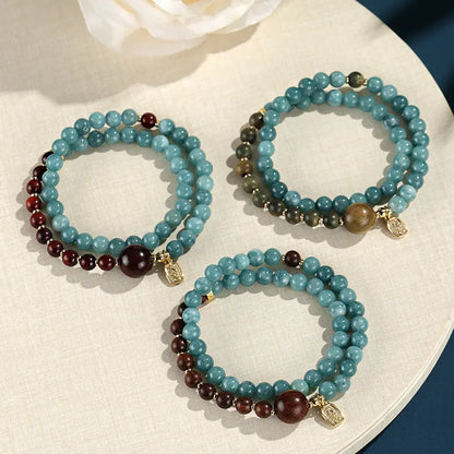 Natural stone blue women's beaded bracelet with geometric shapes and Chinese Fu and Xi characters.