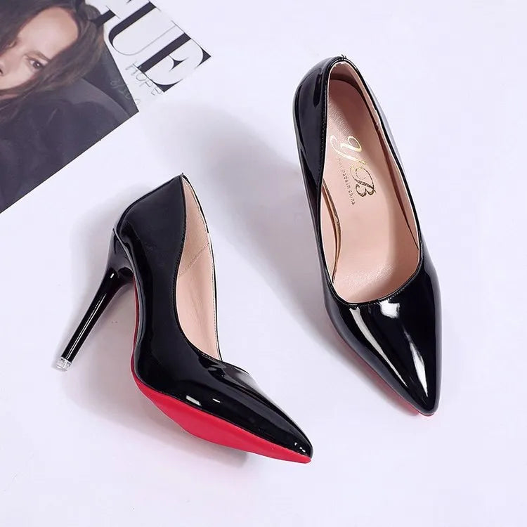 Women's black stiletto heel pumps with pointed toe and shallow mouth design on a neutral background