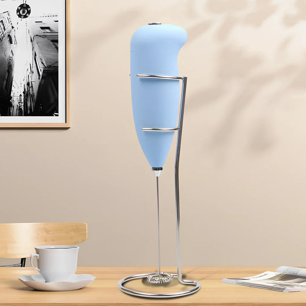 Green electric milk frother measuring 21cm tall with 5cm base creating milk foam