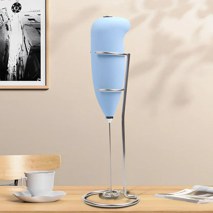 Green electric milk frother measuring 21cm tall with 5cm base creating milk foam
