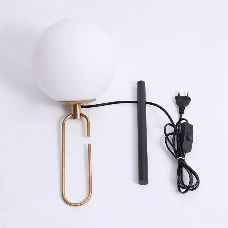 Modern glass wall lamp mounted on a wall, showcasing its clean design and adjustable light colour options.