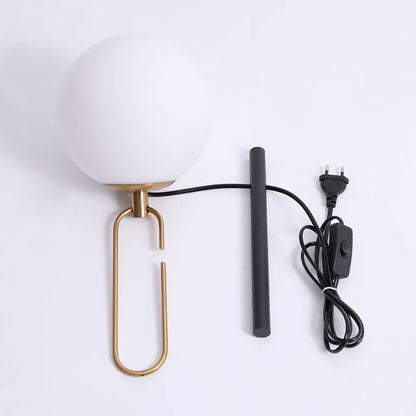 Modern glass wall lamp mounted on a wall, showcasing its clean design and adjustable light colour options.