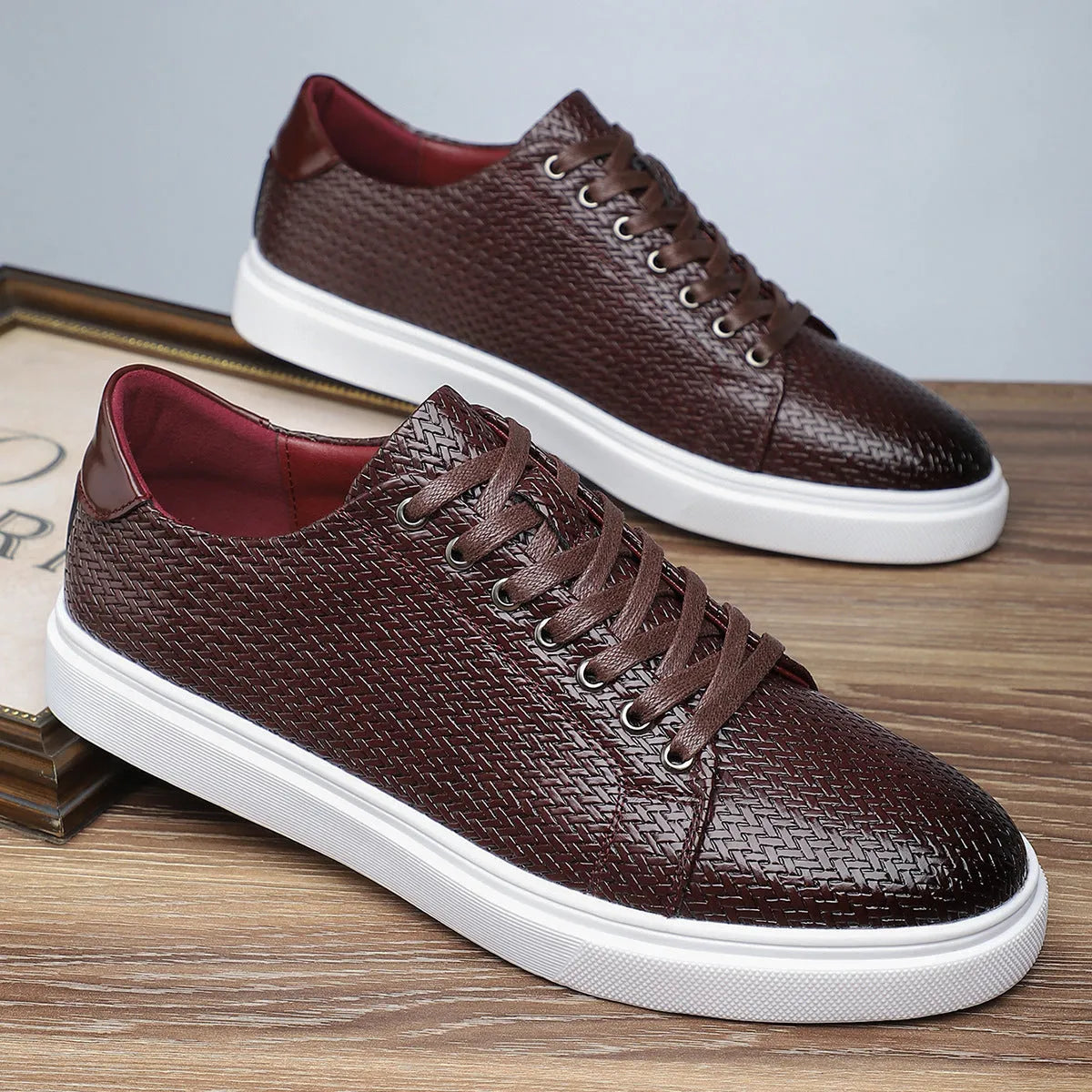 Men's black low-top business shoe with artificial PU leather upper and rubber sole.