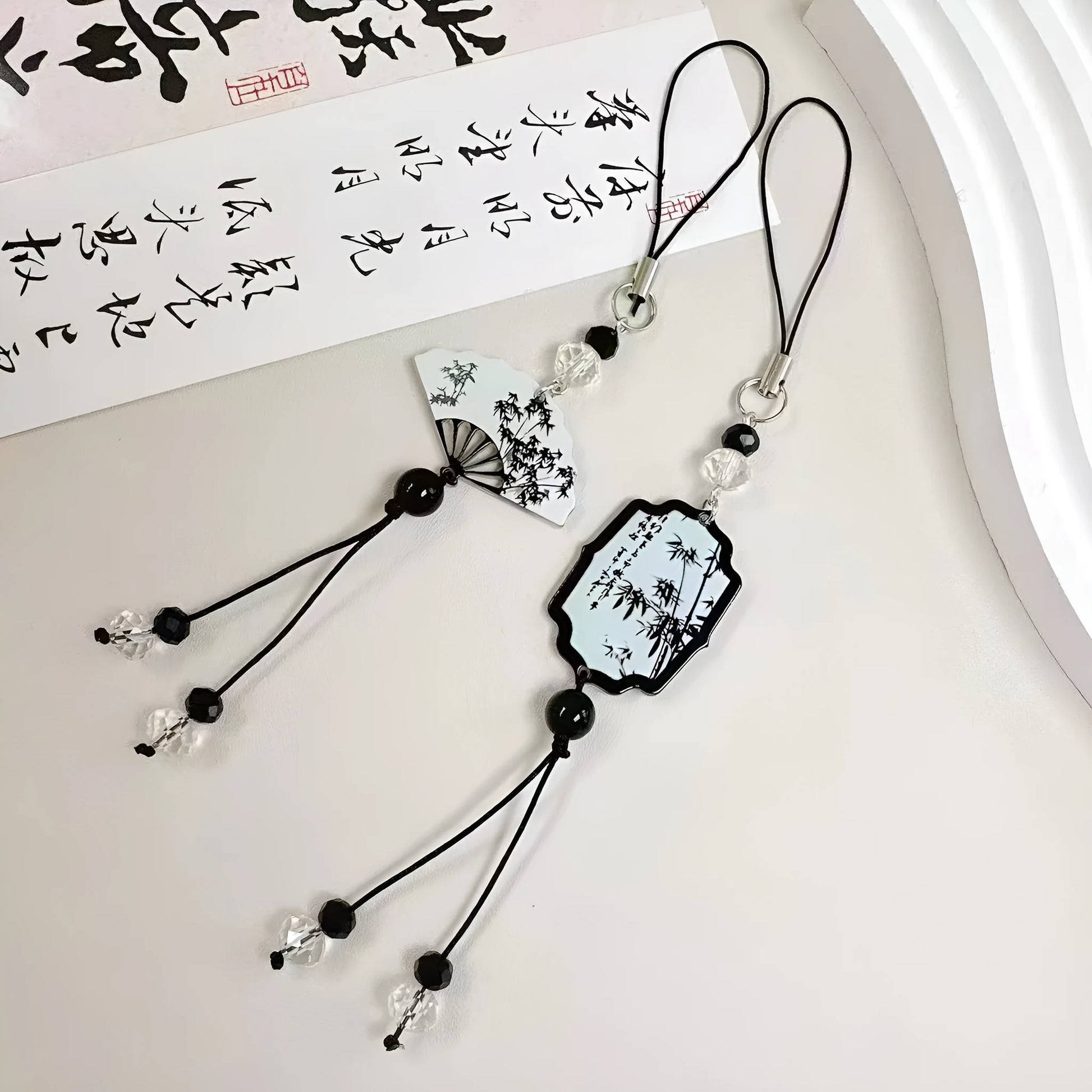 Guofeng Chinese style bead pendant keychain with detailed plants and flowers pattern on a metal clip.
