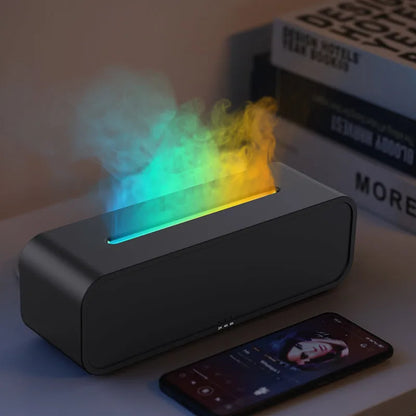 Black Flame Dynamic Aroma Diffuser with colour-changing lights and remote control on a table.