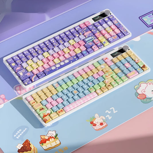 Black iron cow layout mechanical keyboard with RGB backlighting on a desk.