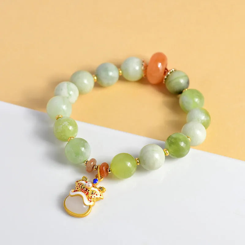 Green milk-in-water Xingshi jade pendant bracelet with geometric retro design on wrist