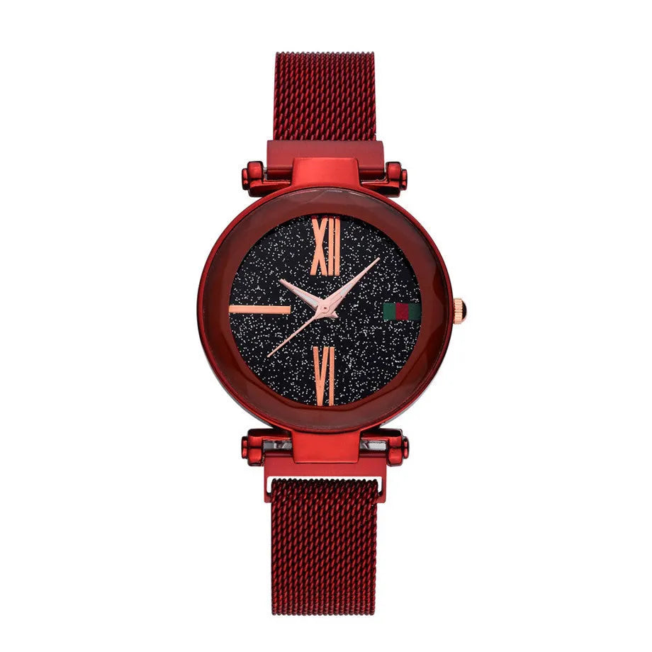 Rose gold ladies watch with round 32mm dial and magnetic stainless steel jewellery clasp on wrist.