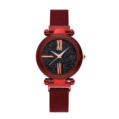 Rose gold ladies watch with round 32mm dial and magnetic stainless steel jewellery clasp on wrist.