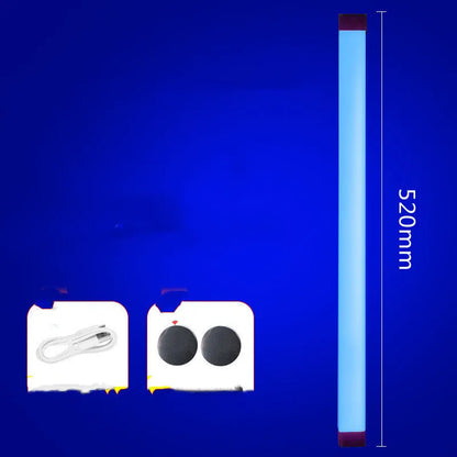 Blue rechargeable LED light tube with USB plug and push-button switch on a dark surface