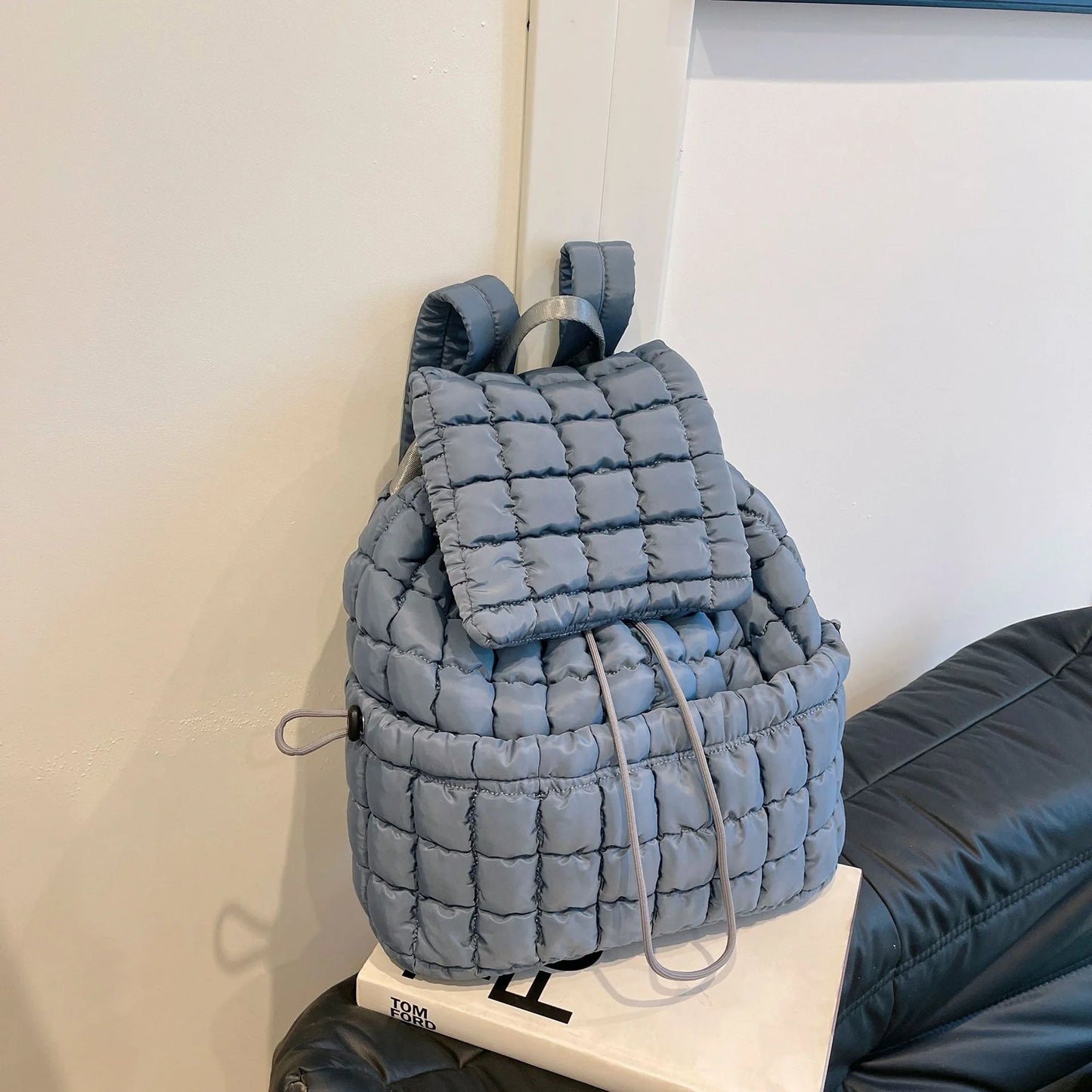 Soft, quilted puffer backpack in a variety of colors, perfect for autumn and winter wear