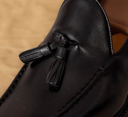 Men's black genuine leather slip-on loafers with polished finish and rubber sole
