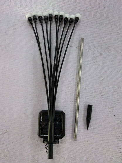 Solar-powered ground plug lawn light with automatic dusk-to-dawn operation and multiple head configurations