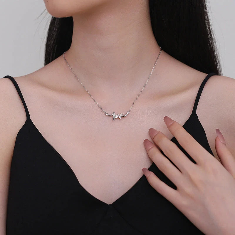 Elegant LOVE Necklace for Women in silver and gold, featuring a delicate O-shaped chain and LOVE pendant.