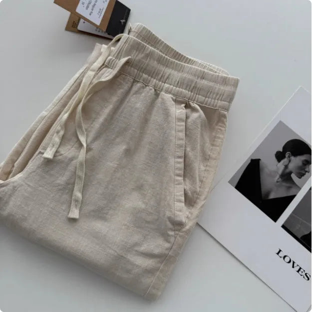 Men's loose straight casual pants with drawstring waist in navy blue colour, showing relaxed fit and straight leg design