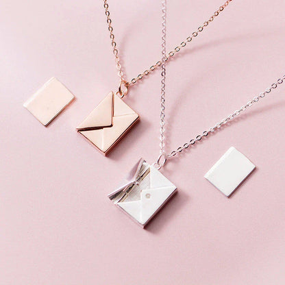 Stylish titanium steel envelope necklace with a discreet compartment for storing personal keepsakes