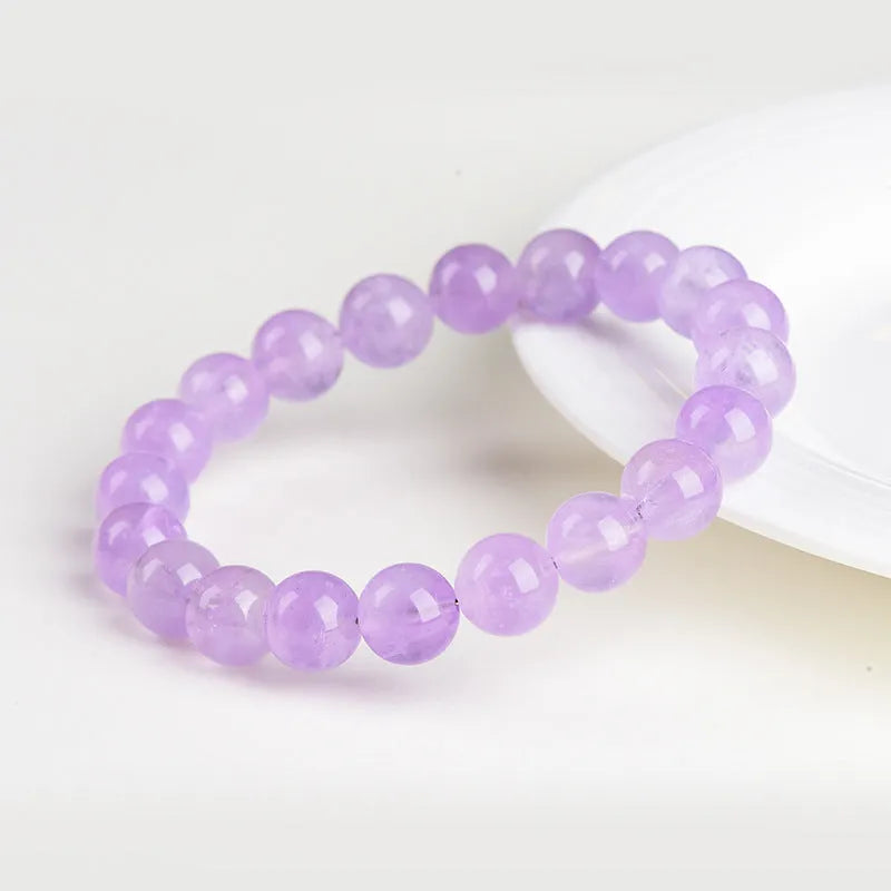 Lavender amethyst bracelet with water ripple geometric beads in various sizes on wrist