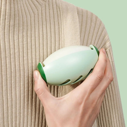 Green and white washable reusable gel lint roller ball for pet hair removal on clothes and furniture