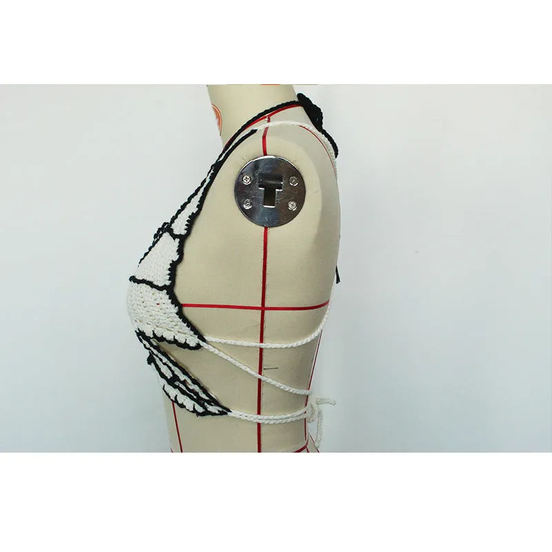 Black and white women's two-piece acrylic bikini swimsuit on a free-size hanger.