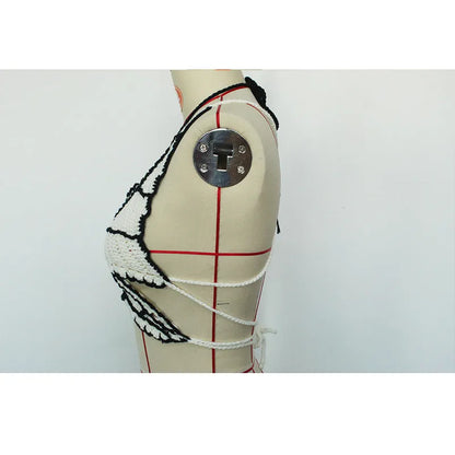 Black and white women's two-piece acrylic bikini swimsuit on a free-size hanger.