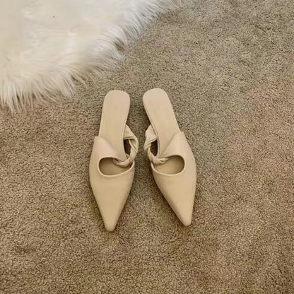 Women's soft leather slippers with semi-toe box in black, khaki, cream-white, and dark brown colours on a rubber sole.