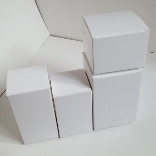 White paper storage boxes showing size variations from 3x3cm to 10x10cm base with different height options