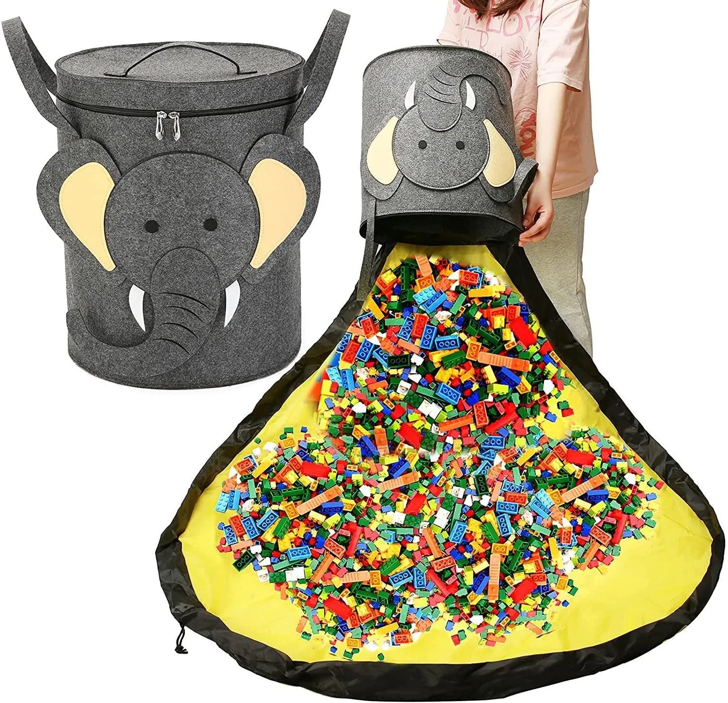 Green felt storage cube with pull rope unfolded into a large square play mat on a wooden floor.