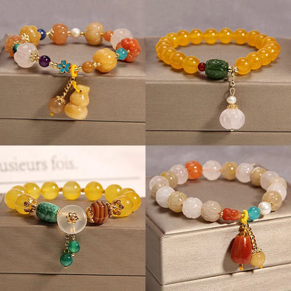 Women's yellow agate crystal bracelet on gold silk cord with Japanese style design