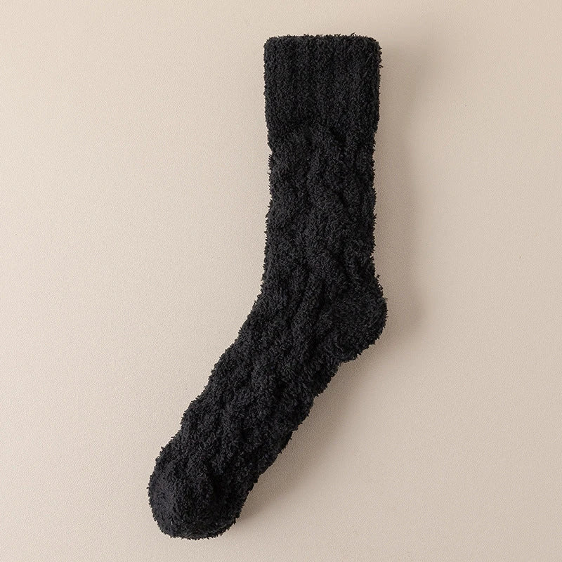 Cozy coral fleece socks in various colors, designed for superior comfort and warmth