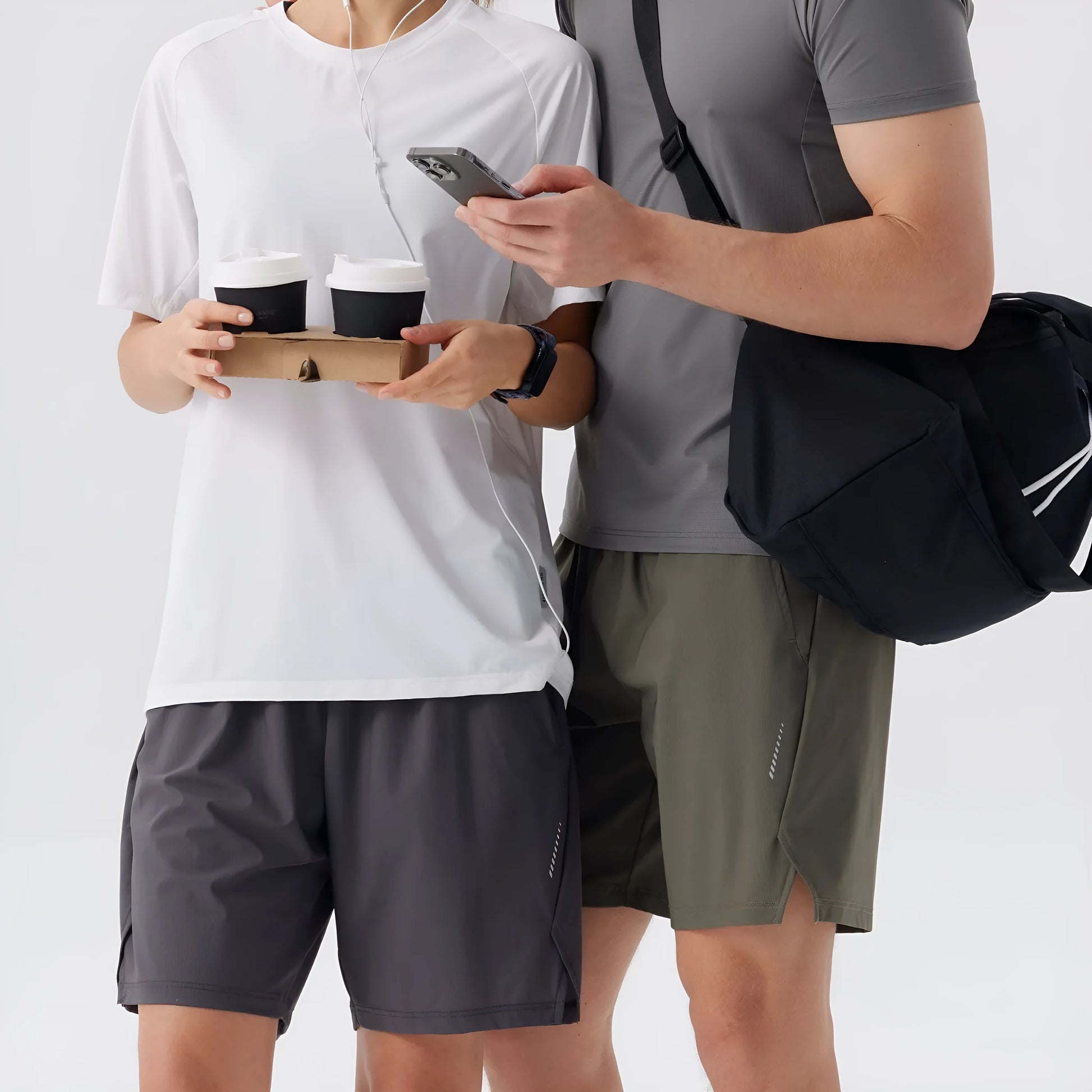 Men's black nylon sports shorts with a mid waist, designed for athletic and casual leisure wear.