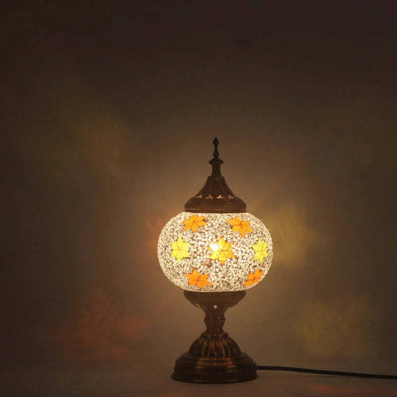 Glass table lamp with 150mm diameter shade and 330cm cord on wooden surface