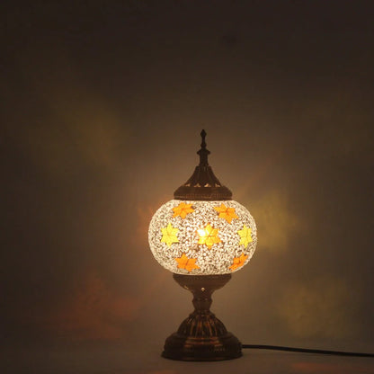 Glass table lamp with 150mm diameter shade and 330cm cord on wooden surface