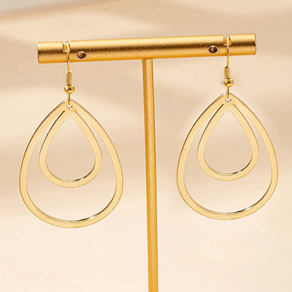 Golden yellow hollow drop earrings made from iron, shown as a single pair for everyday fashion.