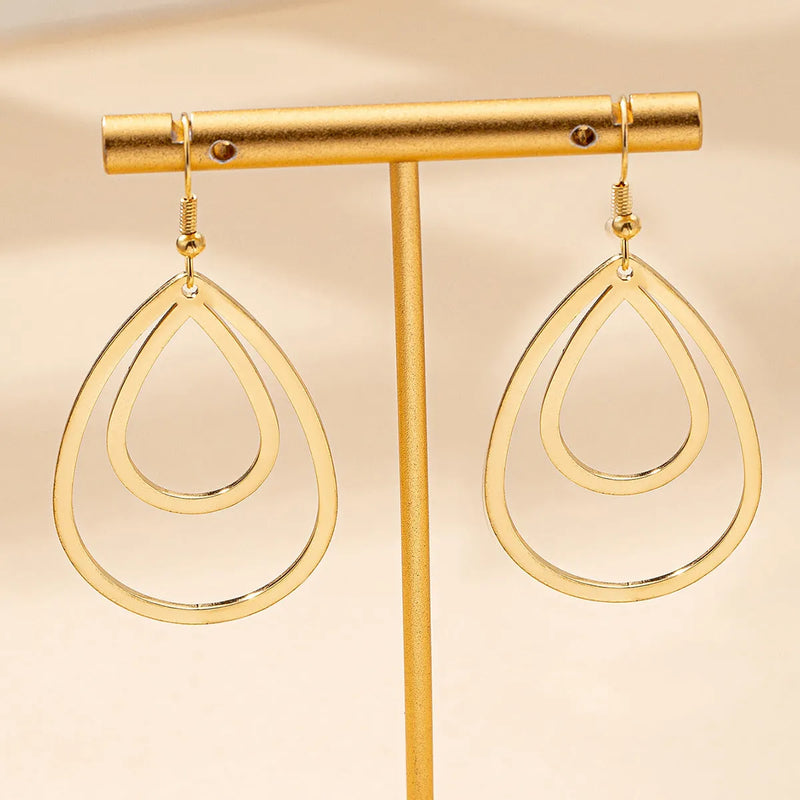Drop-Shaped Hollow Earrings in Golden Yellow Iron with Open Filigree Design for Everyday Fashion and Casual Occasions
