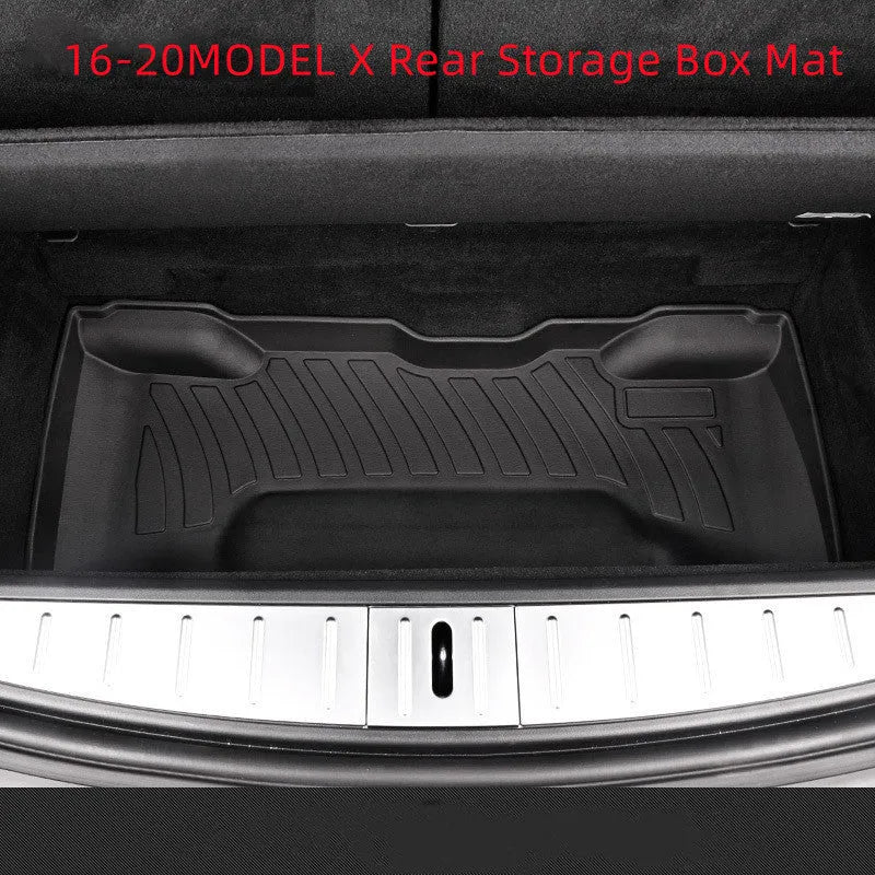 Black TPE rubber floor mats for Tesla Model 3, showing deep grooves and raised edges on driver's side.