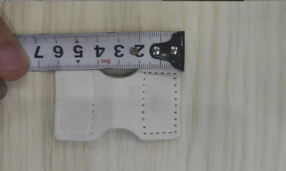 White adjustable silicone wristband with magnetic clasp closure showing 2.5cm width