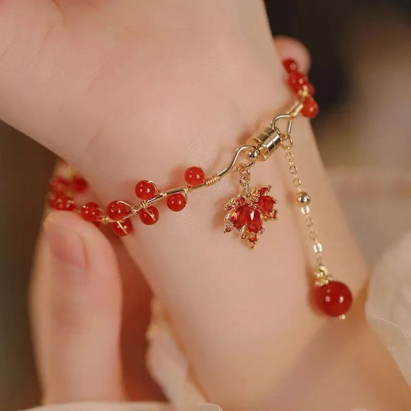 Red ginkgo leaf charm on an alloy magnetic bracelet with a natural Chinese style.