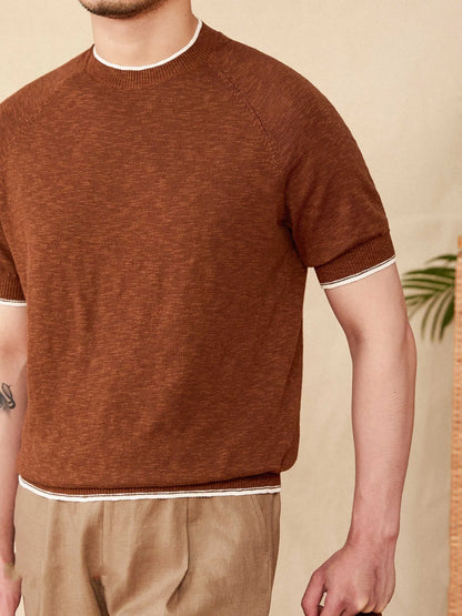 Brown linen-cotton blend short sleeve t-shirt with round neck on a hanger.