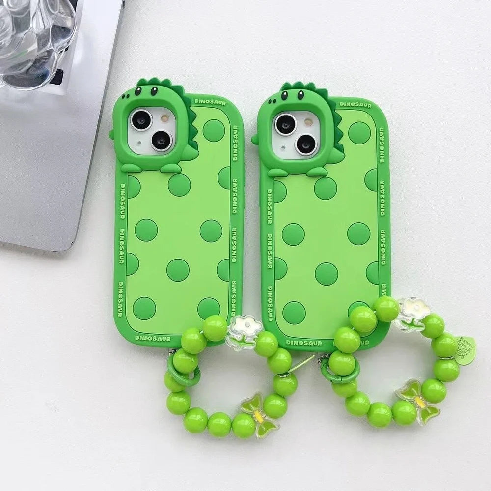 Green polka dot dinosaur silicone phone case showing back design and side protection for iPhone