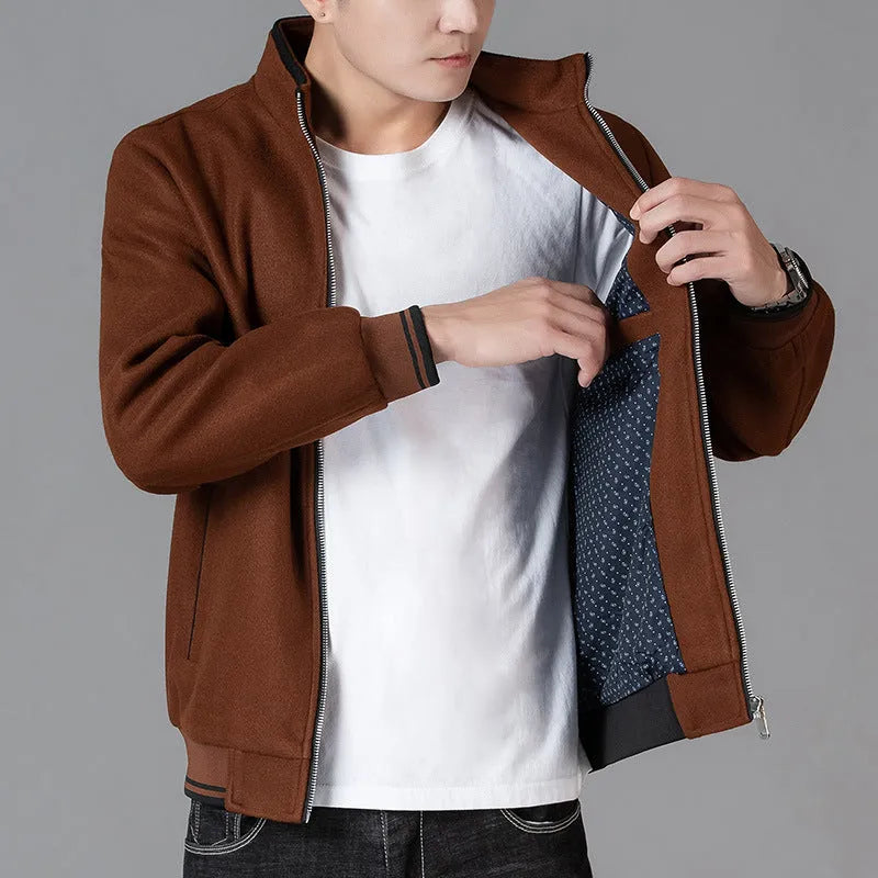 Men's grey sports-style fleece coat with long sleeves and a chest pocket on a hanger.
