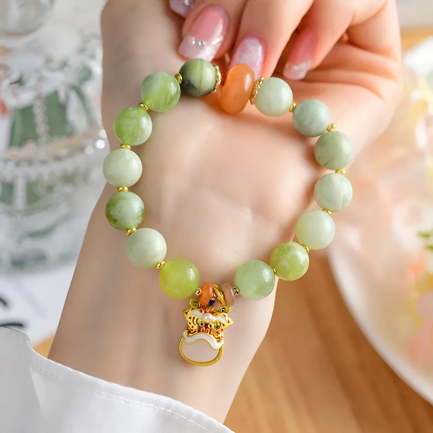 Green milk-in-water Xingshi jade pendant bracelet with geometric retro design on wrist