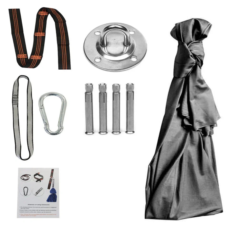 Child in black therapy swing cocoon with multi-loop daisy chain height adjustment system