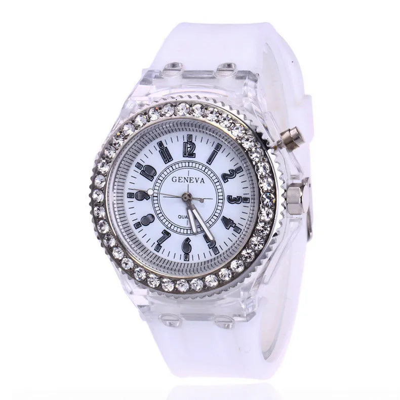 Women's LED luminous quartz watch with silicone strap and round alloy case on wrist
