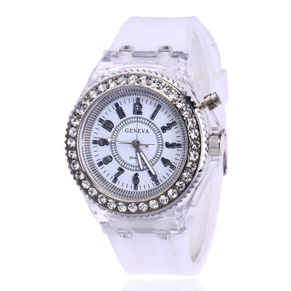 Women's LED luminous quartz watch with silicone strap and round alloy case on wrist