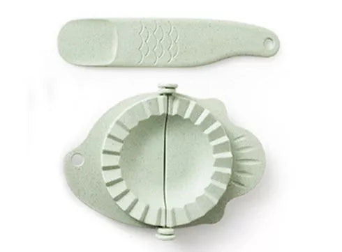 Plastic dumpling maker device in blue, green, and white for quick, uniform dumplings